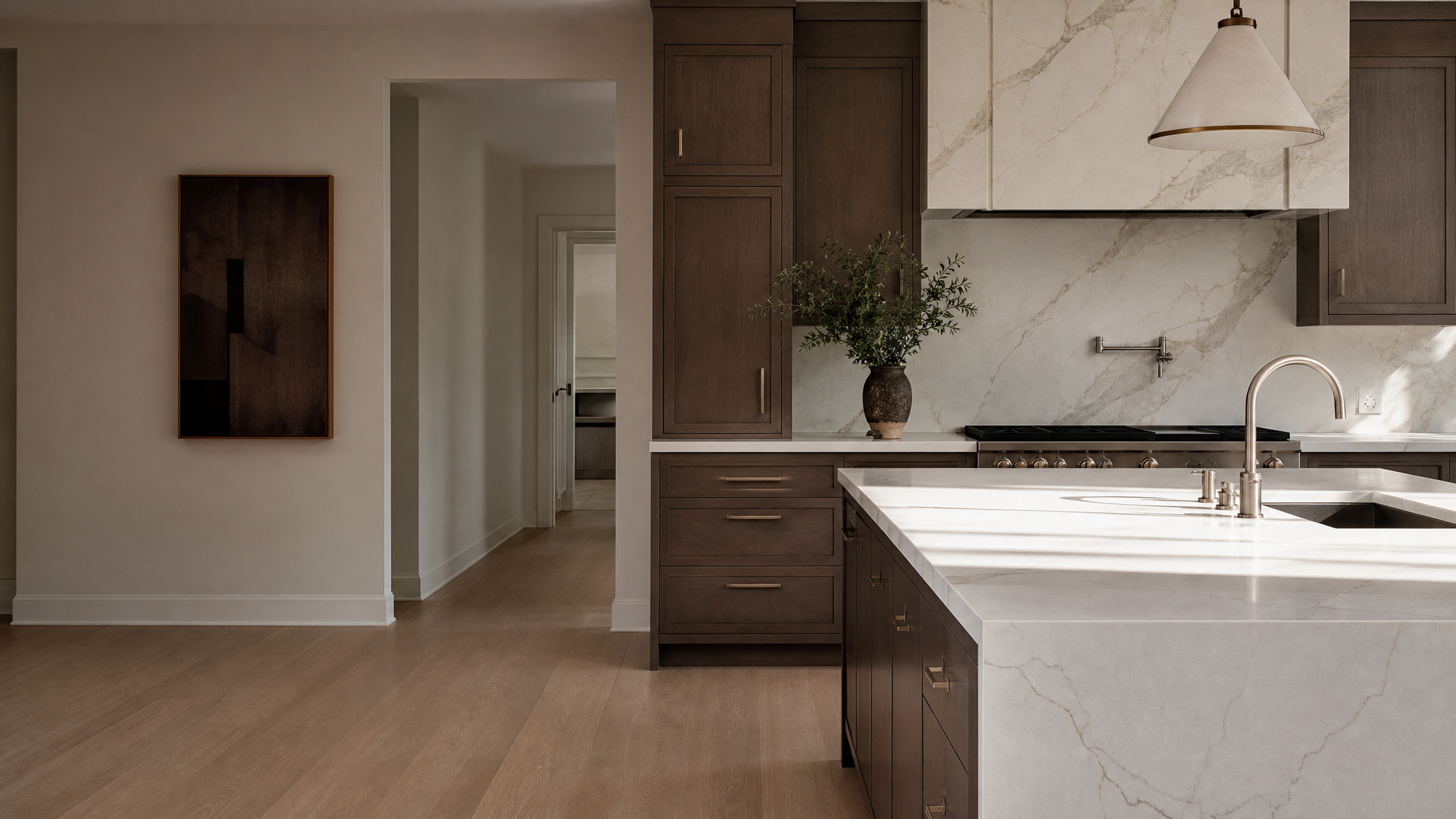 Kitchen with dark cabinets and marble countertop
